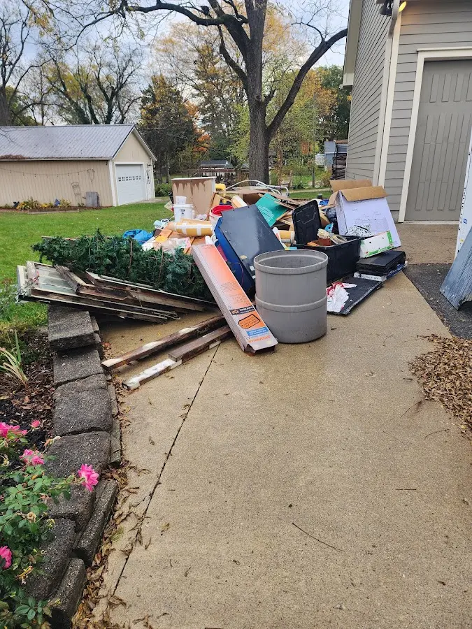 Dumpster being loaded with debris for 3 Yard Dumpster Rental in Marvin